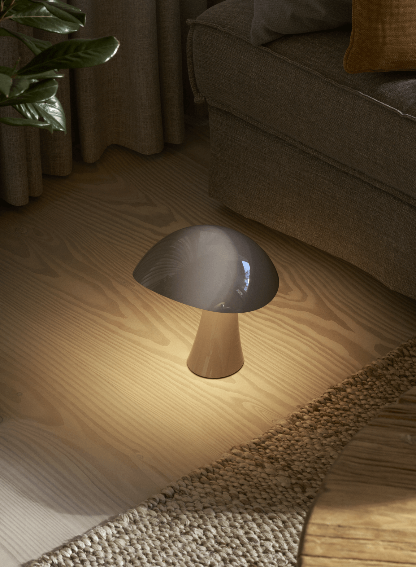 Rumee portable lamp placed on the floor, casting a warm glow in a cozy living room, © 2025 Louis Poulsen